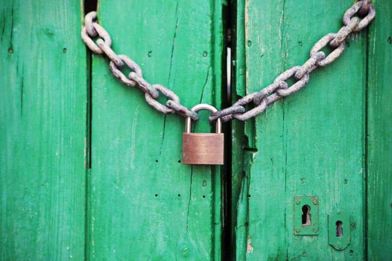 green door with chain and lock