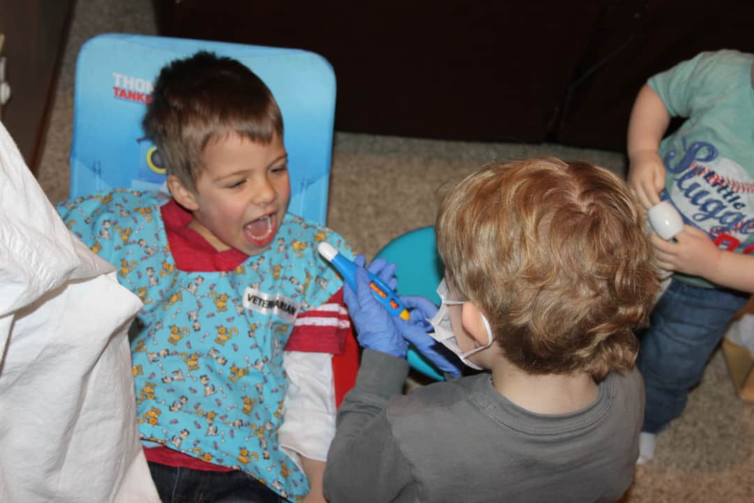 boys playing dentist dramatic play