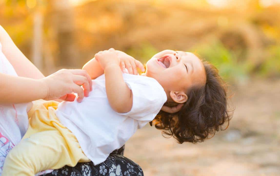 toddler giggling after conflict resolution