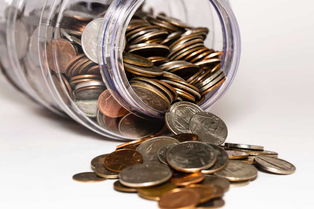 jar of coins spilling out used to teach kids about presidents'