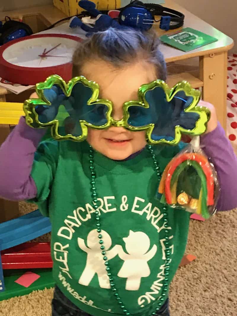 girl holding st. patrick's day treat