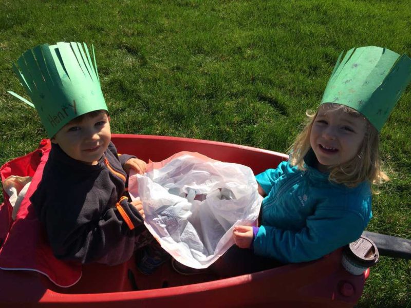 young boy and young girl in wagon  on earth day