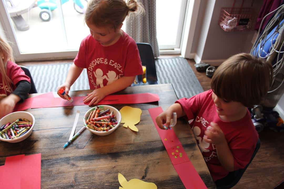 preschool group making paper apple headbands