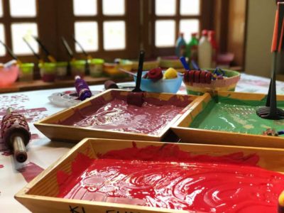 finger painting trays in a classroom