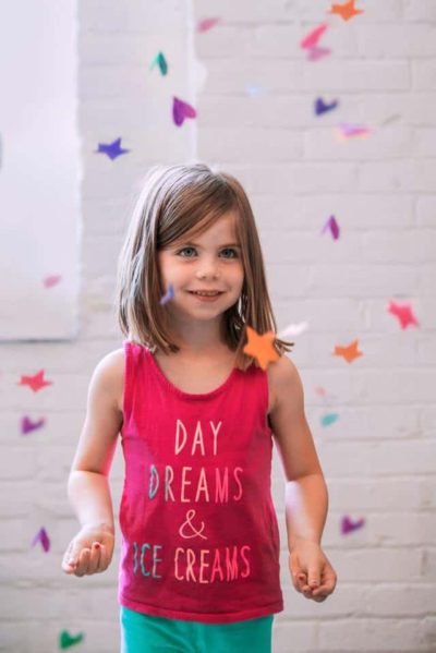 young preschool with floating paper shapes using potty talk