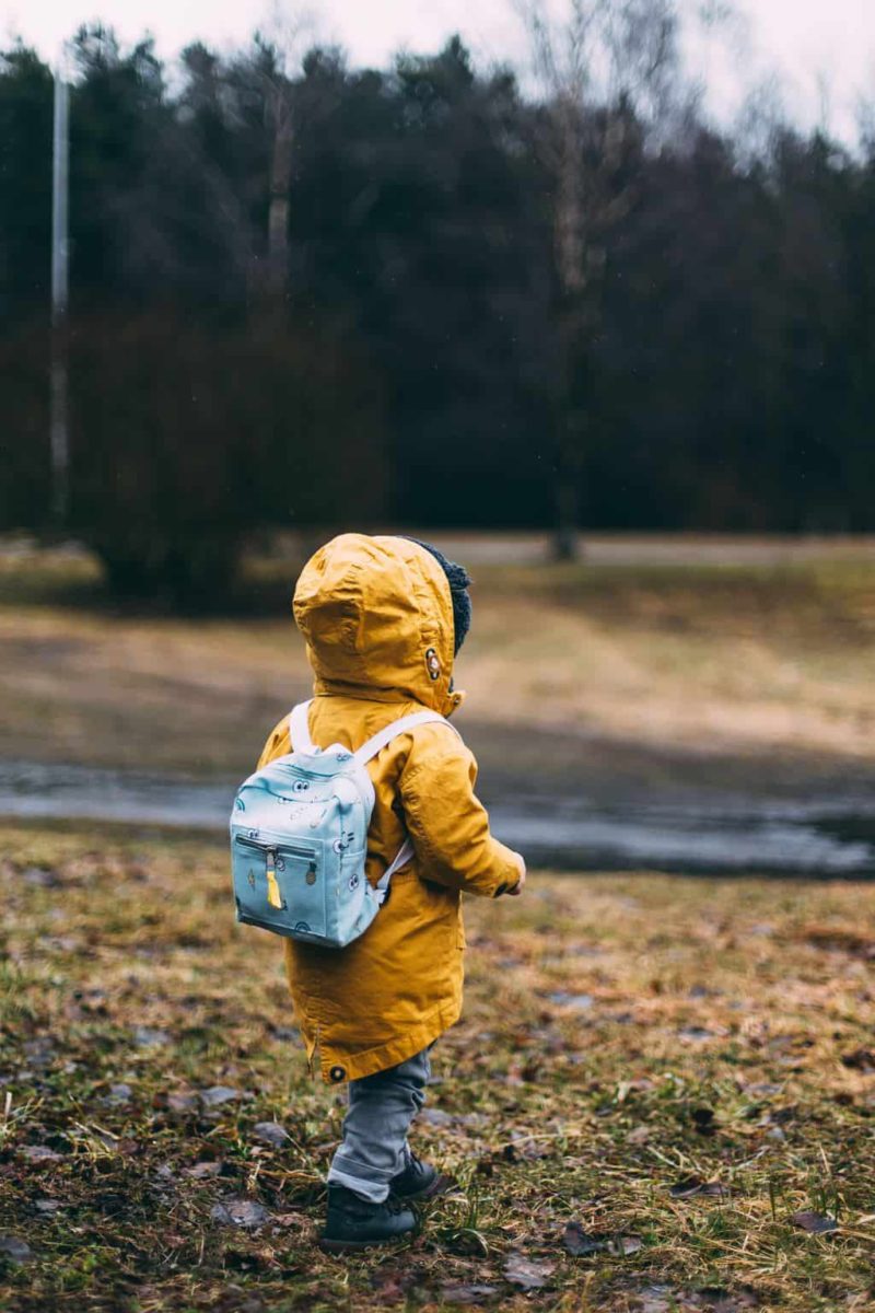 boy walking outside heading to a daycare interview