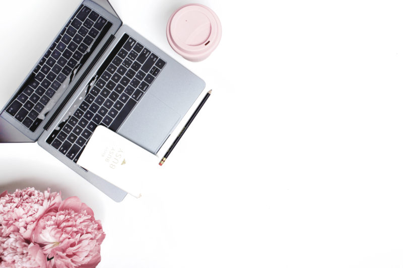 computer with coffee and flowers for provider vacation time planning